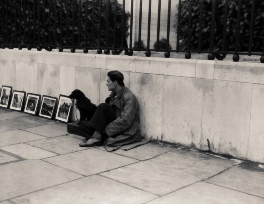 London street-artist (Boardman) with dog 1935.